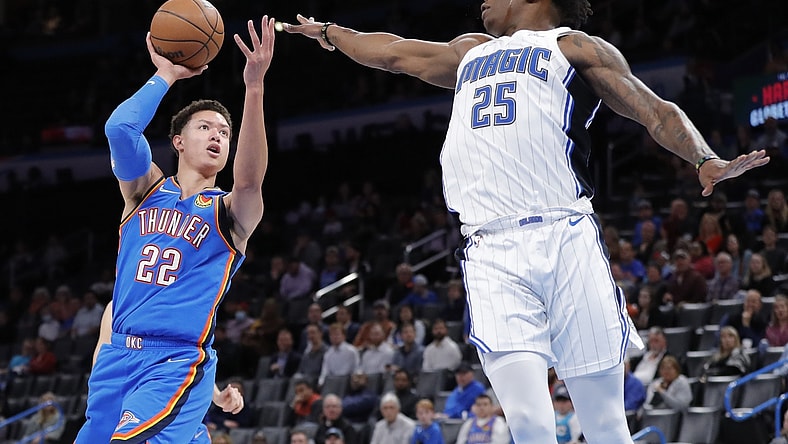 Mar 23, 2022; Oklahoma City, Oklahoma, USA; Oklahoma City Thunder forward Isaiah Roby (22) shoots as Orlando Magic forward Admiral Schofield (25) defends the shot during the second quarter at Paycom Center. Mandatory Credit: Alonzo Adams-USA TODAY Sports