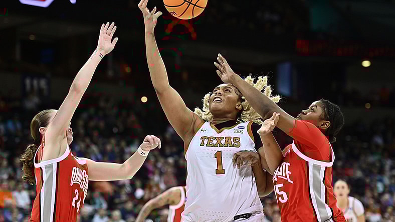 Mar 25, 2022; Spokane, WA, USA; Texas Longhorns center Lauren Ebo (1) tries to catch a pass against Ohio State Buckeyes forward Tanaya Beacham (35)and Ohio State Buckeyes guard Taylor Mikesell (24) in the Spokane regional semifinals of the women's college basketball NCAA Tournament at Spokane Veterans Memorial Arena. Mandatory Credit: James Snook-USA TODAY Sports