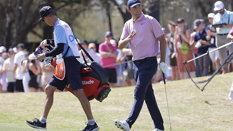 Mar 27, 2022; Austin, Texas, USA; Scottie Scheffler acknowledges his supporters on the 6th hole during the final round of the World Golf Championships-Dell Technologies Match Play golf tournament. Mandatory Credit: Erich Schlegel-USA TODAY Sports