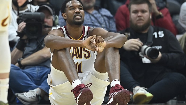 Mar 28, 2022; Cleveland, Ohio, USA; Cleveland Cavaliers center Evan Mobley (4) reacts after he was knocked to the floor in the second quarter against the Orlando Magic at Rocket Mortgage FieldHouse. Mandatory Credit: David Richard-USA TODAY Sports