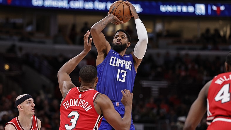 Mar 31, 2022; Chicago, Illinois, USA; LA Clippers guard Paul George (13) shoots against Chicago Bulls center Tristan Thompson (3) during the first half at United Center. Mandatory Credit: Kamil Krzaczynski-USA TODAY Sports