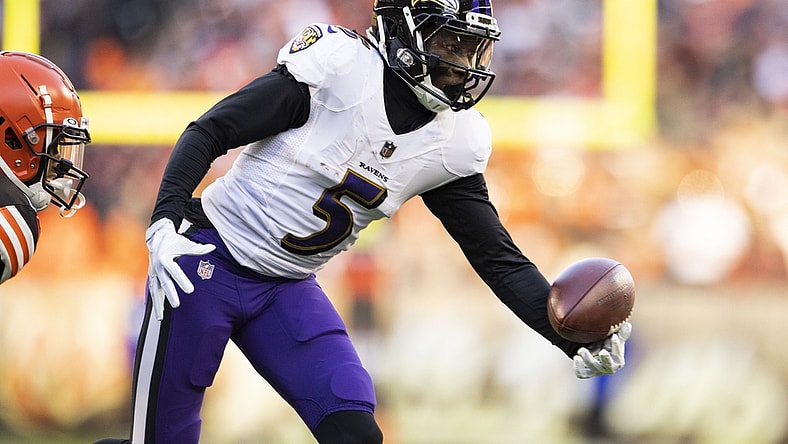 Dec 12, 2021; Cleveland, Ohio, USA; Baltimore Ravens wide receiver Marquise Brown (5) makes a one-handed catch against the Cleveland Browns during the fourth quarter at FirstEnergy Stadium. Mandatory Credit: Scott Galvin-USA TODAY Sports