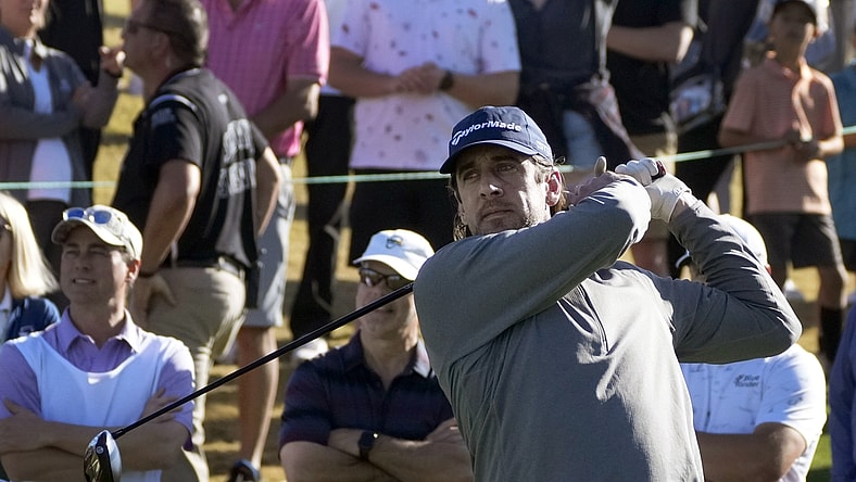 Feb 9, 2022; Scottsdale, AZ, USA; Green Bay Packers quarterback Aaron Rodgers hits from the 11th tee box during the WM Phoenix Open Annexus Pro-Am at TPC Scottsdale. Mandatory Credit: Cheryl Evans-USA TODAY NETWORK