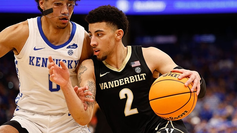 Mar 11, 2022; Tampa, FL, USA; Vanderbilt Commodores guard Scotty Pippen Jr. (2) drives to the basket while guarded by Kentucky Wildcats forward Jacob Toppin (0) in the second half at Amelie Arena. Mandatory Credit: Nathan Ray Seebeck-USA TODAY Sports