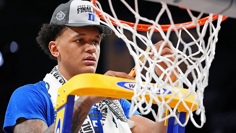 Mar 26, 2022; San Francisco, CA, USA; Duke Blue Devils forward Paolo Banchero (5) cuts a piece of the net as they celebrate their win over the Arkansas Razorbacks in the finals of the West regional of the men's college basketball NCAA Tournament at Chase Center. The Duke Blue Devils won 78-69. Mandatory Credit: Kyle Terada-USA TODAY Sports