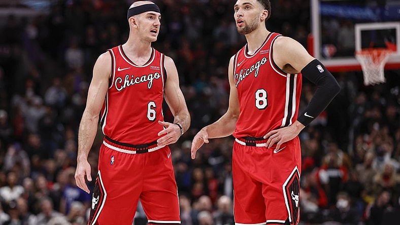 Mar 31, 2022; Chicago, Illinois, USA; Chicago Bulls guard Alex Caruso (6) talks with guard Zach LaVine (8) during overtime of an NBA game against the LA Clippers at United Center. Mandatory Credit: Kamil Krzaczynski-USA TODAY Sports