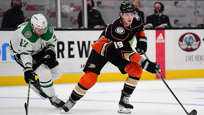 Mar 31, 2022; Anaheim, California, USA; Anaheim Ducks right wing Troy Terry (19) moves the puck ahead of Dallas Stars right wing Alexander Radulov (47) during the third period at Honda Center. Mandatory Credit: Gary A. Vasquez-USA TODAY Sports