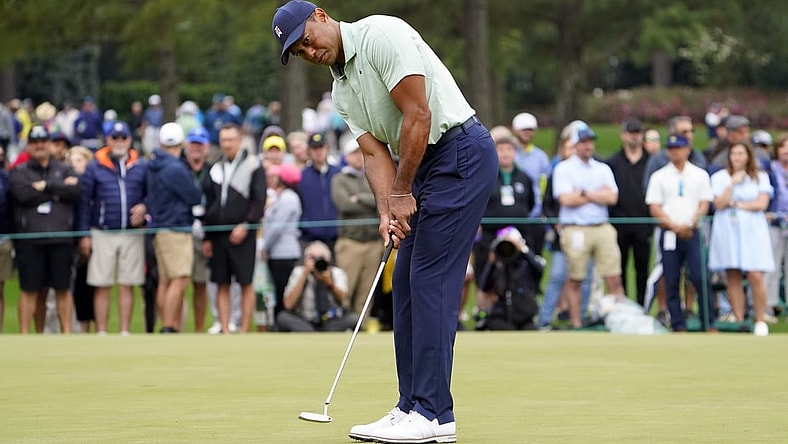 Apr 5, 2022; Augusta, Georgia, USA; Tiger Woods putts on the putting green on the practice range during a practice round of The Masters golf tournament at Augusta National Golf Club. Mandatory Credit: Danielle Parhizkaran-Augusta Chronicle/USA TODAY Network