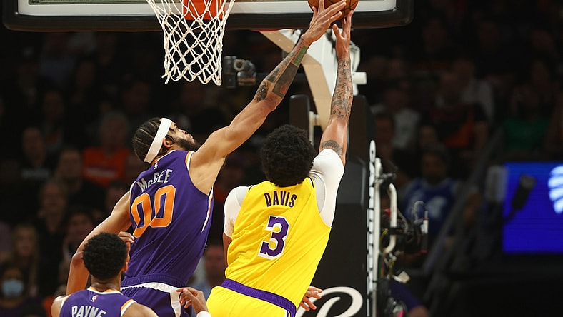Apr 5, 2022; Phoenix, Arizona, USA; Los Angeles Lakers forward Anthony Davis (3) has his shot blocked by Phoenix Suns center JaVale McGee (00) in the first half at Footprint Center. Mandatory Credit: Mark J. Rebilas-USA TODAY Sports