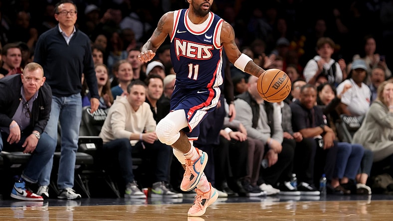 Apr 8, 2022; Brooklyn, New York, USA; Brooklyn Nets guard Kyrie Irving (11) brings the ball up court against the Cleveland Cavaliers during the fourth quarter at Barclays Center. Mandatory Credit: Brad Penner-USA TODAY Sports