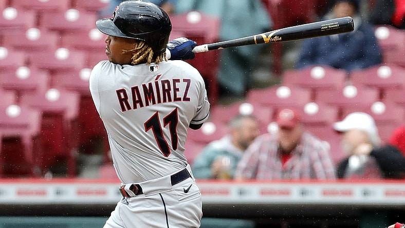 Apr 13, 2022; Cincinnati, Ohio, USA; Cleveland Guardians third baseman Jose Ramirez (11) hits a double against the Cincinnati Reds during the sixth inning at Great American Ball Park. Mandatory Credit: David Kohl-USA TODAY Sports
