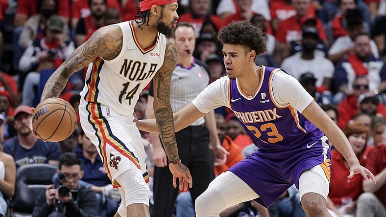 Apr 24, 2022; New Orleans, Louisiana, USA;  New Orleans Pelicans forward Brandon Ingram (14) dribbles against Phoenix Suns forward Cameron Johnson (23) during the first half of game four of the first round of the 2022 NBA playoffs at Smoothie King Center. Mandatory Credit: Stephen Lew-USA TODAY Sports