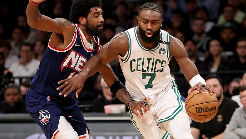 Apr 25, 2022; Brooklyn, New York, USA; Boston Celtics guard Jaylen Brown (7) controls the ball against Brooklyn Nets guard Kyrie Irving (11) during the fourth quarter of game four of the first round of the 2022 NBA playoffs at Barclays Center. The Celtics defeated the Nets 116-112 to win the best of seven series 4-0. Mandatory Credit: Brad Penner-USA TODAY Sports