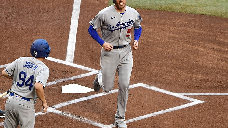 Apr 25, 2022; Phoenix, Arizona, USA; Los Angeles Dodgers first baseman Freddie Freeman (5) scores in the first inning against the Arizona Diamondbacks at Chase Field. Mandatory Credit: Matt Kartozian-USA TODAY Sports