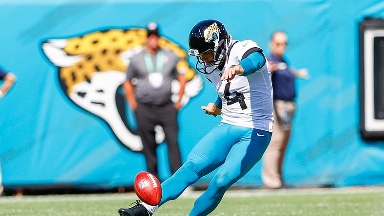 Sep 26, 2021; Jacksonville, Florida, USA; Jacksonville Jaguars kicker Josh Lambo (4) kicks the ball in the third quarter against the Arizona Cardinals at TIAA Bank Field. Mandatory Credit: Nathan Ray Seebeck-USA TODAY Sports
