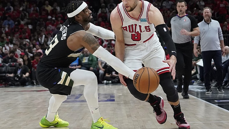 Apr 24, 2022; Chicago, Illinois, USA; Milwaukee Bucks guard Wesley Matthews (23) defends Chicago Bulls guard Zach LaVine (8) in the second half during game four of the first round for the 2022 NBA playoffs at United Center. Mandatory Credit: David Banks-USA TODAY Sports