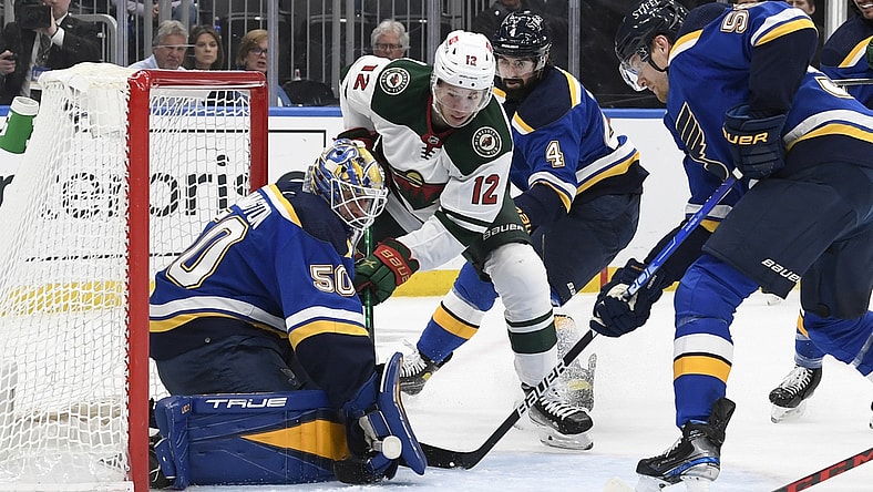 May 12, 2022; St. Louis, Missouri, USA; St. Louis Blues goaltender Jordan Binnington (50) makes a save on Minnesota Wild left wing Matt Boldy (12) during the first period in game six of the first round of the 2022 Stanley Cup Playoffs at Enterprise Center. Mandatory Credit: Jeff Le-USA TODAY Sports