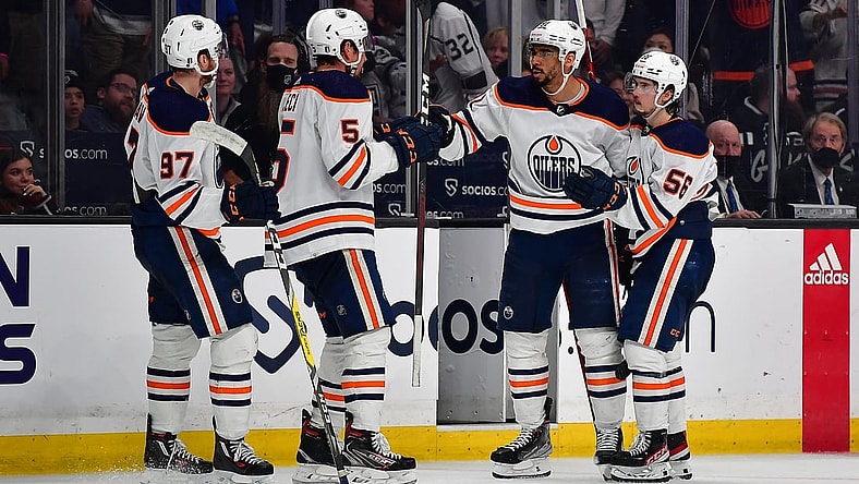 May 12, 2022; Los Angeles, California, USA; Edmonton Oilers left wing Evander Kane (91) celebrates with center Connor McDavid (97) defenseman Cody Ceci (5) and right wing Kailer Yamamoto (56) his empty net goal scored against the Los Angeles Kings during the third period in game six of the first round of the 2022 Stanley Cup Playoffs at Crypto.com Arena. Mandatory Credit: Gary A. Vasquez-USA TODAY Sports