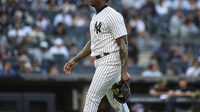 May 22, 2022; Bronx, New York, USA;  New York Yankees relief pitcher Aroldis Chapman (54) walks off the mound in the ninth inning after blowing a save against the Chicago White Sox at Yankee Stadium. Mandatory Credit: Wendell Cruz-USA TODAY Sports