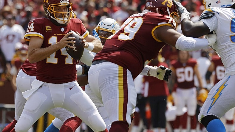 Sep 12, 2021; Landover, Maryland, USA; Washington Football Team quarterback Ryan Fitzpatrick (14) prepares to pass the ball against the Los Angeles Chargers at FedExField. Mandatory Credit: Geoff Burke-USA TODAY Sports