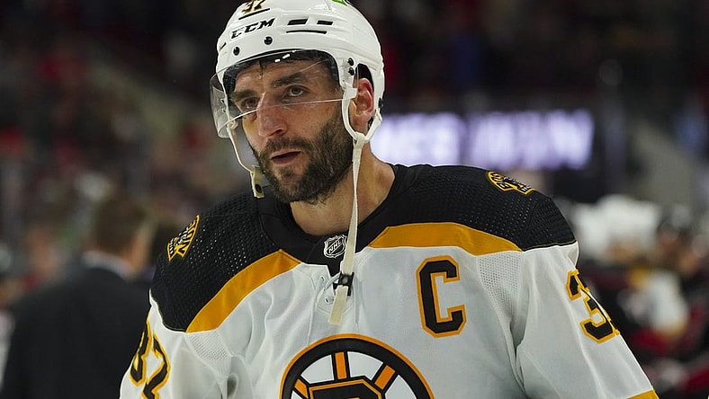 May 14, 2022; Raleigh, North Carolina, USA; Boston Bruins center Patrice Bergeron (37) leaves the ice after the game against the Carolina Hurricanes in game seven of the first round of the 2022 Stanley Cup Playoffs at PNC Arena. Mandatory Credit: James Guillory-USA TODAY Sports