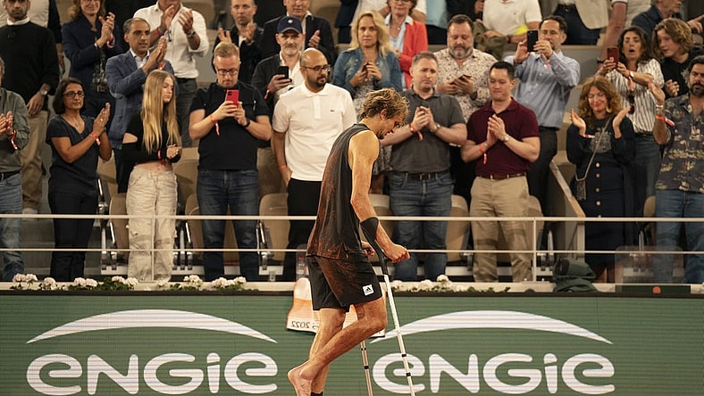 June 3, 2022; Paris, France; Alexander Zverev (GER) leaves the court on crutches after retiring from his semifinal match against Rafael Nadal (ESP)on day 13 of the French Open at Stade Roland-Garros. Mandatory Credit: Susan Mullane-USA TODAY Sports