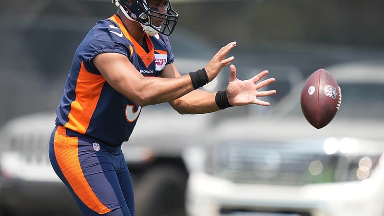 Jun 13, 2022; Englewood, CO, USA; Denver Broncos quarterback Russell Wilson (3) during mini camp drills at the UCHealth Training Center. Mandatory Credit: Ron Chenoy-USA TODAY Sports