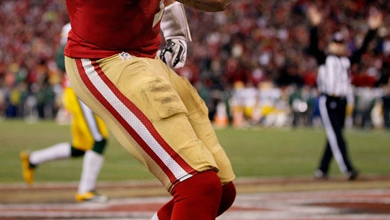 San Francisco 49ers quarterback Colin Kaepernick (7) flexes his muscles after scoring a touchdown during their 45-31 victory over Green Bay Packers in their NFC Divisional playoff game Saturday, January 11, 2013 at Candlestick Park in San Francisco, Calif.

Packers13 14 Spt Wood