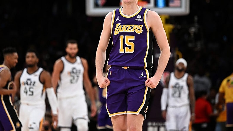 Feb 16, 2022; Los Angeles, California, USA; Los Angeles Lakers guard Austin Reaves (15) celebrates after making a three-point basket in the final seconds against the Utah Jazz at Crypto.com Arena. Mandatory Credit: Jayne Kamin-Oncea-USA TODAY Sports