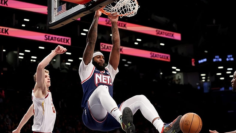 Apr 8, 2022; Brooklyn, New York, USA; Brooklyn Nets center Andre Drummond (0) dunks against Cleveland Cavaliers forward Lauri Markkanen (24) during the fourth quarter at Barclays Center. Mandatory Credit: Brad Penner-USA TODAY Sports