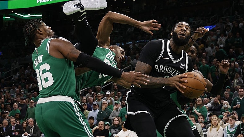 Apr 20, 2022; Boston, Massachusetts, USA; Boston Celtics center Al Horford (42) goes tumbling between guard Marcus Smart (36) and Brooklyn Nets center Andre Drummond (0) during the third quarter of game two of the first round of the 2022 NBA playoffs at TD Garden. Mandatory Credit: Winslow Townson-USA TODAY Sports