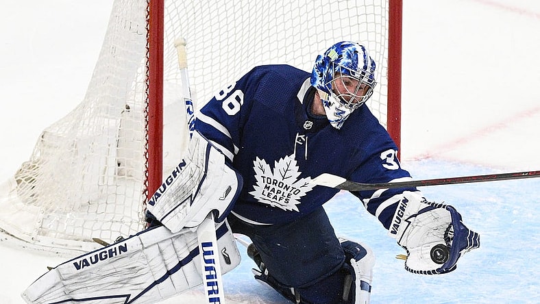 May 14, 2022; Toronto, Ontario, CAN;  Toronto Maple Leafs goalie Jack Campbell (36) makes a glove save against the Tampa Bay Lightning in game seven of the first round of the 2022 Stanley Cup Playoffs at Scotiabank Arena. Mandatory Credit: Dan Hamilton-USA TODAY Sports