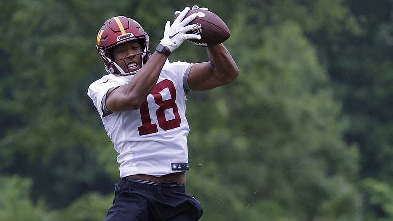 May 24, 2022; Asburn, VA, USA; Washington Commanders wide receiver Antonio Gandy-Golden (18) catches a pass during drills as part of OTAs at The Park in Ashburn. Mandatory Credit: Geoff Burke-USA TODAY Sports