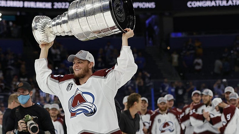 Jun 26, 2022; Tampa, Florida, USA; Colorado Avalanche left wing Andre Burakovsky (95) celebrates with the Stanley Cup after the Avalanche game against the Tampa Bay Lightning in game six of the 2022 Stanley Cup Final at Amalie Arena. Mandatory Credit: Geoff Burke-USA TODAY Sports