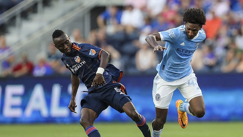 Jun 29, 2022; Cincinnati, Ohio, USA; FC Cincinnati midfielder Obinna Nwobodo (5) battles for the ball against New York City FC forward Talles Magno (43) in the first half at TQL Stadium. Mandatory Credit: Katie Stratman-USA TODAY Sports