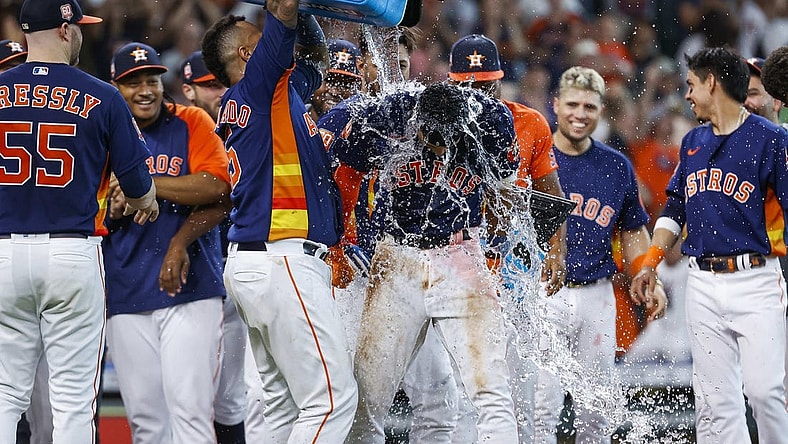 Jul 3, 2022; Houston, Texas, USA; Houston Astros shortstop Jeremy Pena (3) has water poured on his head by catcher Martin Maldonado (15) after hitting a walk-off home run during the ninth inning against the Los Angeles Angels at Minute Maid Park. Mandatory Credit: Troy Taormina-USA TODAY Sports