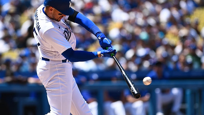 Jul 24, 2022; Los Angeles, California, USA; Los Angeles Dodgers right fielder Trayce Thompson (25) hits a single and earns a RBI against the San Francisco Giants during the third inning at Dodger Stadium. Mandatory Credit: Jonathan Hui-USA TODAY Sports