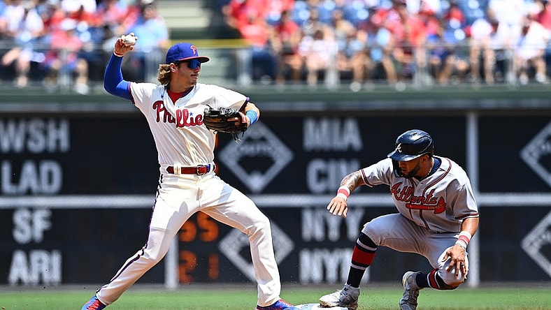 Jul 27, 2022; Philadelphia, Pennsylvania, USA; Philadelphia Phillies infielder Bryson Stott (5) attempts to turn a double play over Atlanta Braves outfielder Eddie Rosario (8) in the second inning at Citizens Bank Park. Mandatory Credit: Kyle Ross-USA TODAY Sports