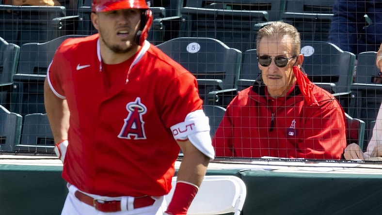 Mar 16, 2021; Tempe, Arizona, USA; Los Angeles Angels owner Arte Moreno (right) and outfielder Mike Trout against the Cleveland Indians during a Spring Training game at Tempe Diablo Stadium. Mandatory Credit: Mark J. Rebilas-USA TODAY Sports