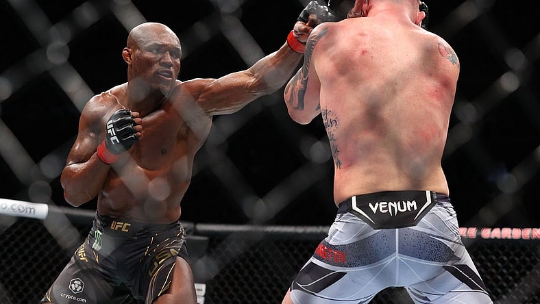 Nov 6, 2021; New York, NY, USA; Kamaru Usman (red gloves) competes against Colby Covington (blue gloves) during UFC 268 at Madison Square Garden. Mandatory Credit: Ed Mulholland-USA TODAY Sports