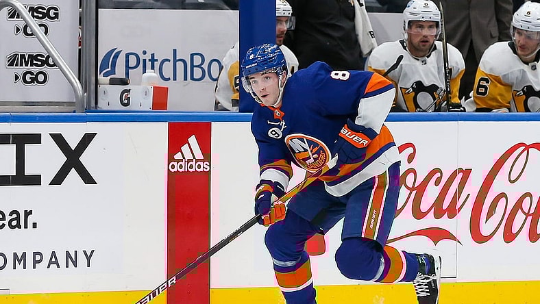 Apr 12, 2022; Elmont, New York, USA; New York Islanders defenseman Noah Dobson (8) skates with the puck against the Pittsburgh Penguins during the second period at UBS Arena. Mandatory Credit: Tom Horak-USA TODAY Sports