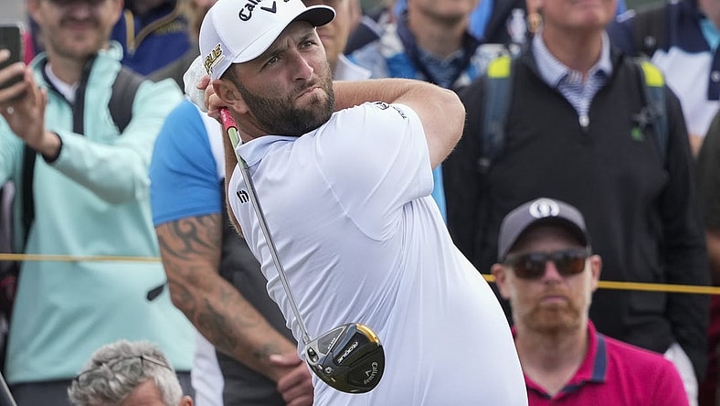 Jul 12, 2022; St. Andrews,Fife, SCT; Jon Rahm hits his tee shot on the 5th hole during a practice round for the 150th Open Championship golf tournament at St. Andrews Old Course. Mandatory Credit: Michael Madrid-USA TODAY Sports
