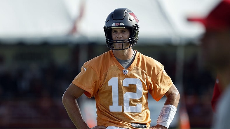 Jul 28, 2022; Tampa, FL, USA;  Tampa Bay Buccaneers quarterback Tom Brady (12) looks on during training camp at AdventHealth Training Center. Mandatory Credit: Kim Klement-USA TODAY Sports