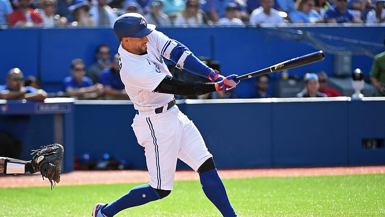Jul 30, 2022; Toronto, Ontario, CAN; Toronto Blue Jays designated hitter George Springer (4) hits a fielders choice single in the sixth inning again the Detroit Tigers at Rogers Centre. Mandatory Credit: Gerry Angus-USA TODAY Sports