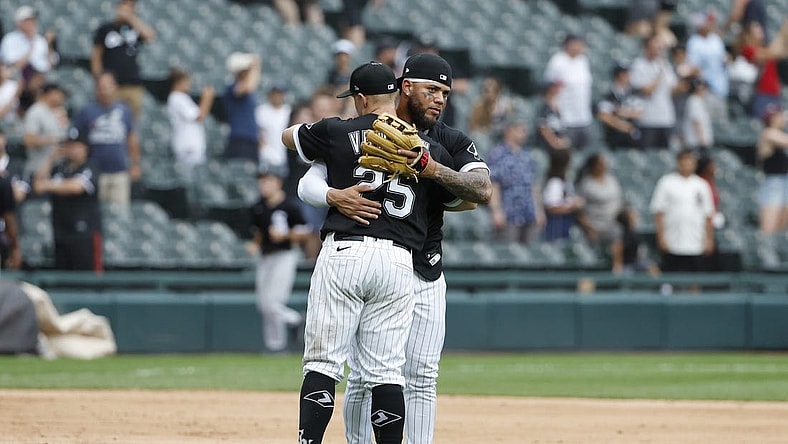 Aug 3, 2022; Chicago, Illinois, USA; Chicago White Sox designated hitter Andrew Vaughn (25) and third baseman Yoan Moncada (10) celebrate their win against the Kansas City Royals at Guaranteed Rate Field. Mandatory Credit: Kamil Krzaczynski-USA TODAY Sports