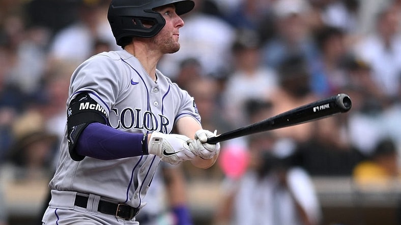 Aug 4, 2022; San Diego, California, USA; Colorado Rockies second baseman Ryan McMahon (24) watches his three-run home run against the San Diego Padres during the fifth inning at Petco Park. Mandatory Credit: Orlando Ramirez-USA TODAY Sports