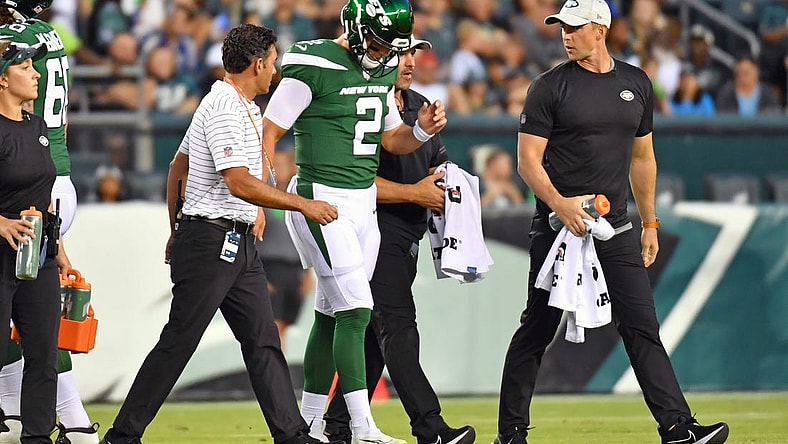 Aug 12, 2022; Philadelphia, Pennsylvania, USA; New York Jets quarterback Zach Wilson (2)  is helped off the field against the Philadelphia Eagles during the first quarter at Lincoln Financial Field. Mandatory Credit: Eric Hartline-USA TODAY Sports