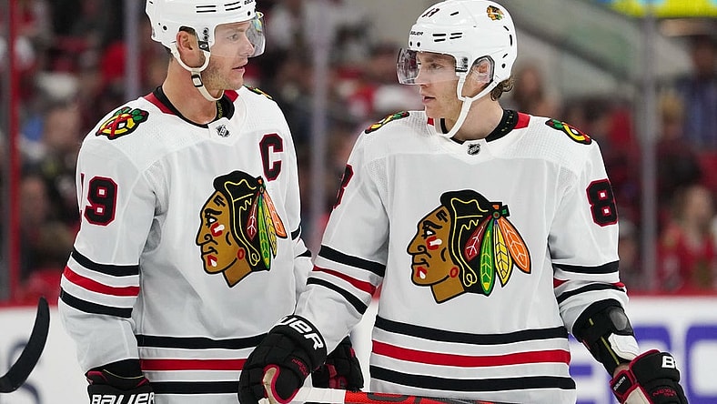 Oct 26, 2019; Raleigh, NC, USA;  Chicago Blackhawks center Jonathan Toews (19) and right wing Patrick Kane (88) talk against the Carolina Hurricanes at PNC Arena. The Carolina Hurricanes defeated the Chicago Blackhawks 4-0. Mandatory Credit: James Guillory-USA TODAY Sports