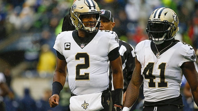Oct 25, 2021; Seattle, Washington, USA; New Orleans Saints quarterback Jameis Winston (2) and running back Alvin Kamara (41) return to the sideline during the first quarter against the Seattle Seahawks at Lumen Field. Mandatory Credit: Joe Nicholson-USA TODAY Sports