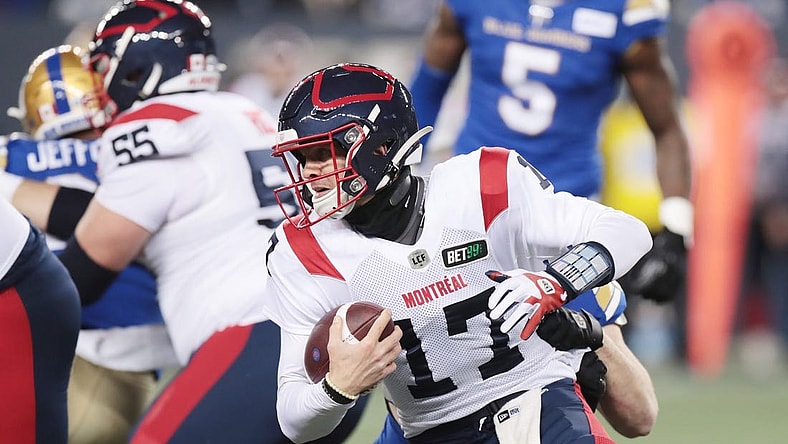 Nov 6, 2021; Winnipeg, Manitoba, CAN; Montreal Alouettes quarterback Trevor Harris (17) is tackled from behind during a Canadian football League game at IG Field. Mandatory Credit: Bruce Fedyck-USA TODAY Sports